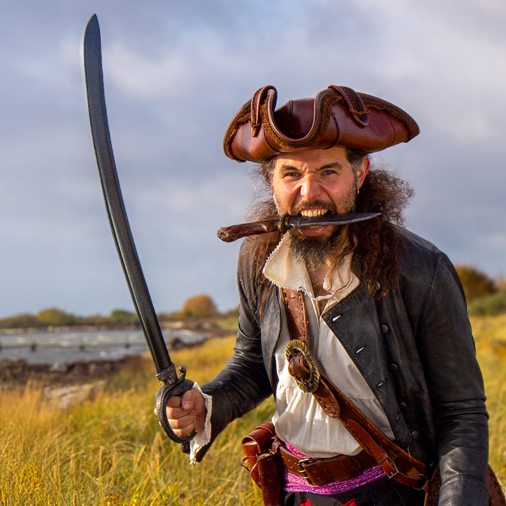 A pirate wields the Classic Curved Cutlass